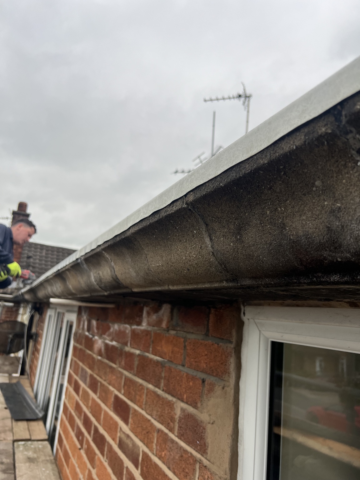 Before: deteriorated concrete Finlock gutter at an Oswestry home